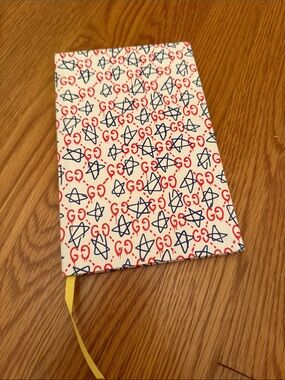 Gucci Boutique Notebook with stickers inside.